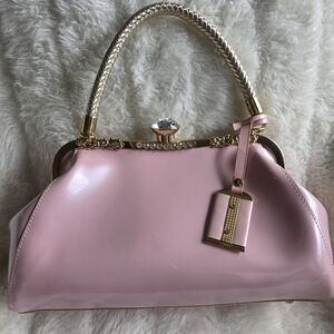 Sophisticated Pink Shoulder Bag with Gold Accents